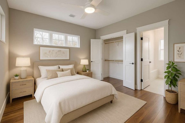 105 Elkhart St Unit 3, Austin, TX 78702 - bedroom with a closet, dark wood-type flooring, baseboards, and ensuite bathroom