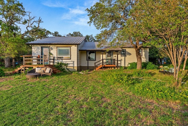 1181 Live Oak Trl, Liberty Hill, TX 78642 - rear view of property with metal roof and a lawn