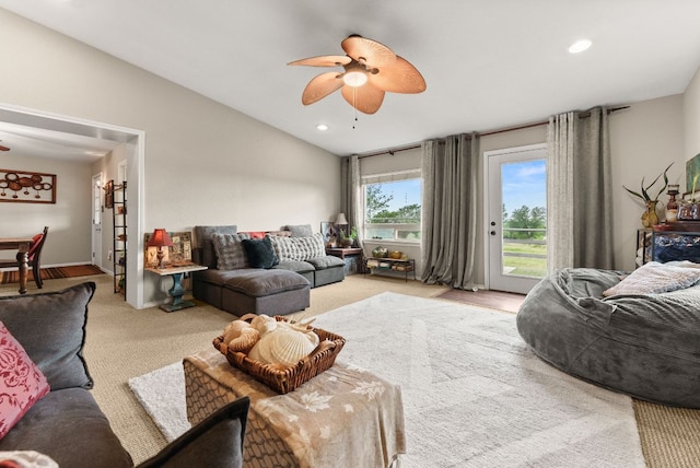 1181 Live Oak Trl, Liberty Hill, TX 78642 - carpeted living area featuring a ceiling fan, lofted ceiling, and recessed lighting