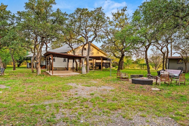 1181 Live Oak Trl, Liberty Hill, TX 78642 - view of green lawn featuring a patio area and a carport