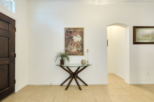 227 Village Park Dr, Georgetown, TX 78633 - entrance foyer featuring arched walkways, light tile patterned flooring, and baseboards