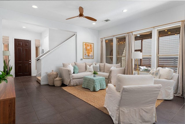 1518 Frontier Valley Dr, Austin, TX 78741 - living room featuring ceiling fan, recessed lighting, dark tile patterned flooring, and stairway