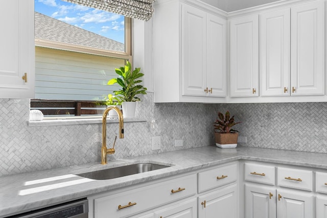 1518 Frontier Valley Dr, Austin, TX 78741 - kitchen featuring a sink, white cabinets, decorative backsplash, and dishwashing machine