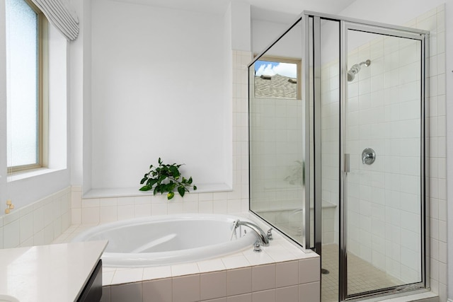 1518 Frontier Valley Dr, Austin, TX 78741 - full bath with a garden tub, a shower stall, and vanity