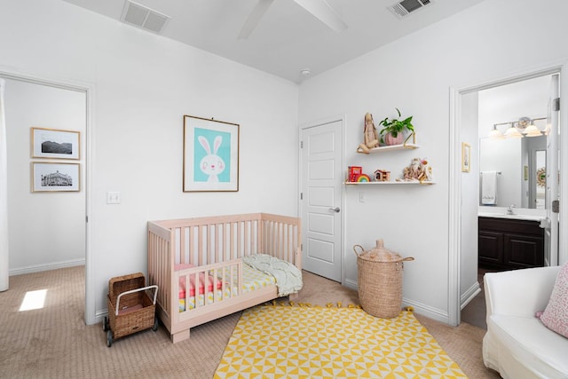 1518 Frontier Valley Dr, Austin, TX 78741 - bedroom with a nursery area, light carpet, baseboards, and ensuite bath