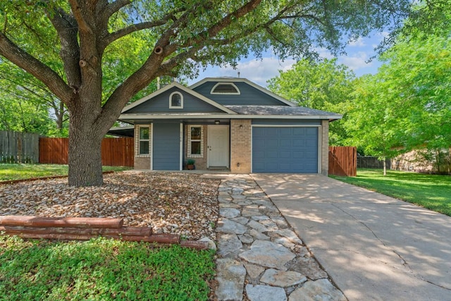 8508 Croydon Loop, Austin, TX 78748 - view of front facade featuring an attached garage, brick siding, driveway, and a porch