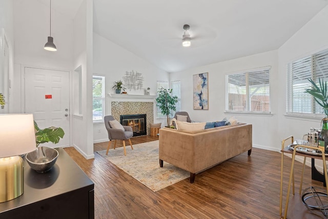 8508 Croydon Loop, Austin, TX 78748 - living room featuring a ceiling fan, dark wood-style floors, a fireplace, baseboards, and high vaulted ceiling