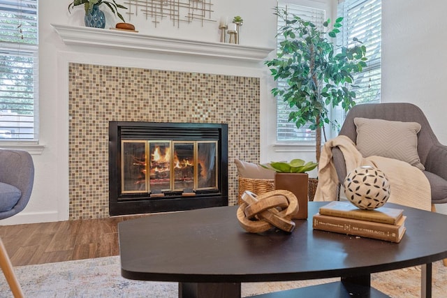 8508 Croydon Loop, Austin, TX 78748 - living area featuring a fireplace, wood finished floors, and plenty of natural light