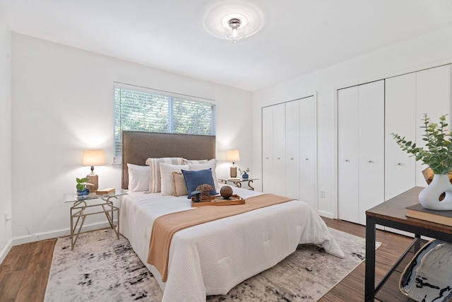 8508 Croydon Loop, Austin, TX 78748 - bedroom featuring two closets, wood finished floors, and baseboards
