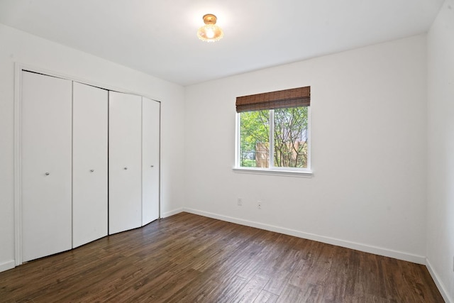 8508 Croydon Loop, Austin, TX 78748 - unfurnished bedroom with dark wood-style floors, baseboards, and a closet