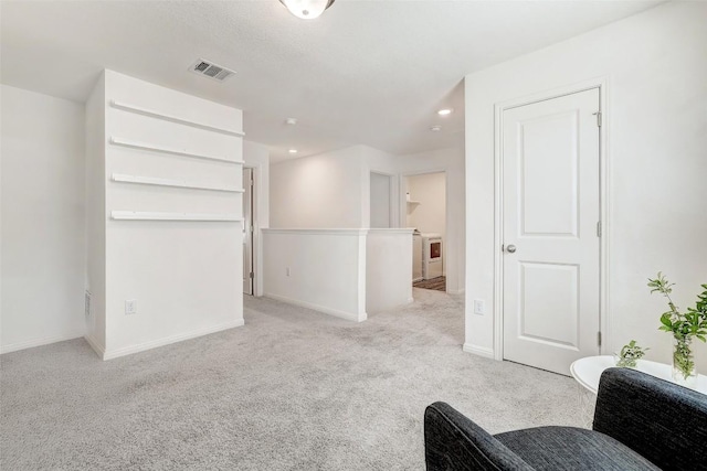 163 Wonderful Life Way, Jarrell, TX 76537 - sitting room with carpet floors, baseboards, recessed lighting, and washer / clothes dryer