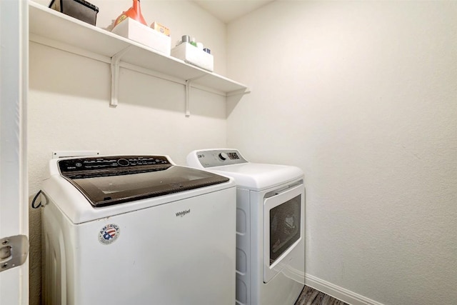 163 Wonderful Life Way, Jarrell, TX 76537 - laundry room featuring separate washer and dryer, baseboards, and wood finished floors