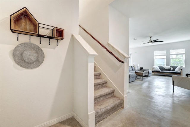 163 Wonderful Life Way, Jarrell, TX 76537 - stairway featuring concrete floors, ceiling fan, and baseboards