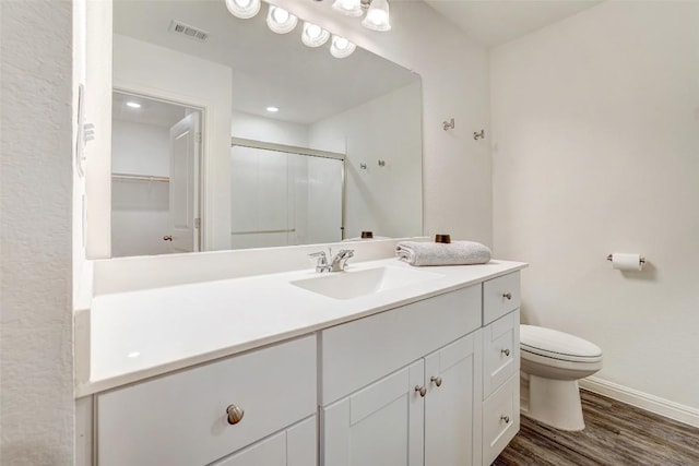 163 Wonderful Life Way, Jarrell, TX 76537 - full bath with toilet, vanity, wood finished floors, a shower stall, and baseboards