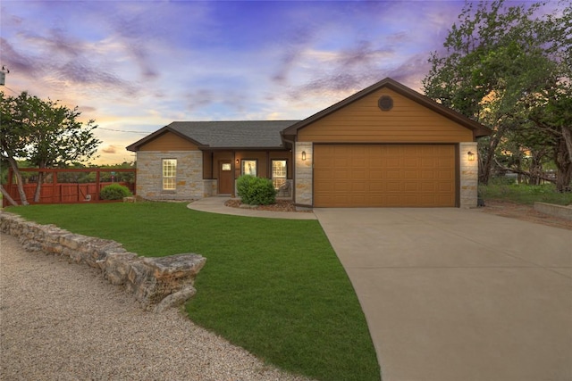 596 Riviera Dr, Canyon Lake, TX 78133 - single story home with stone siding, an attached garage, and concrete driveway