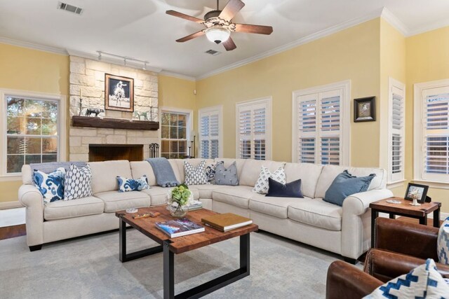 1221 Havre Lafitte Dr, Austin, TX 78746 - living room featuring a ceiling fan, crown molding, a fireplace, and track lighting