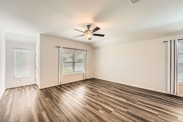 506 Hendelson Ln, Hutto, TX 78634 - unfurnished room with ceiling fan, dark wood-style floors, and lofted ceiling