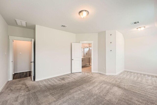 506 Hendelson Ln, Hutto, TX 78634 - unfurnished bedroom with light carpet and ensuite bathroom