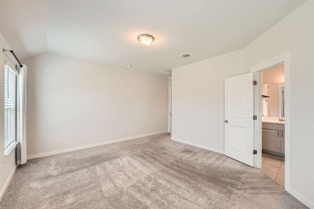 506 Hendelson Ln, Hutto, TX 78634 - empty room featuring light carpet and lofted ceiling