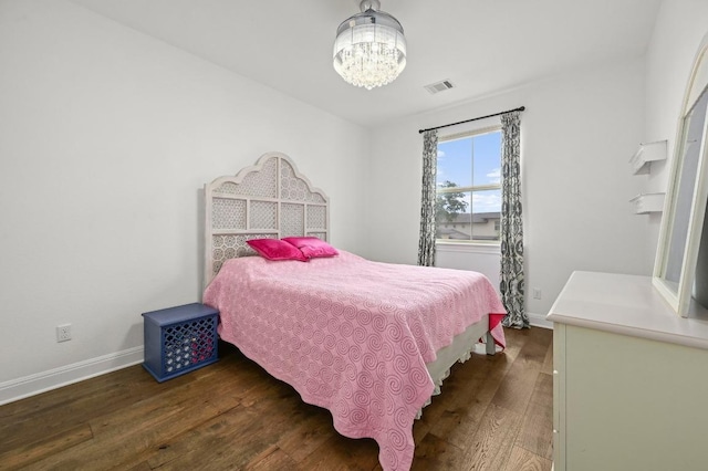 2625 Arion Cir, Austin, TX 78730 - bedroom with hardwood / wood-style floors, baseboards, and a chandelier