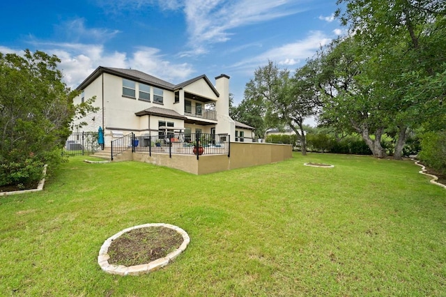2625 Arion Cir, Austin, TX 78730 - rear view of house featuring a balcony, a chimney, and stucco siding