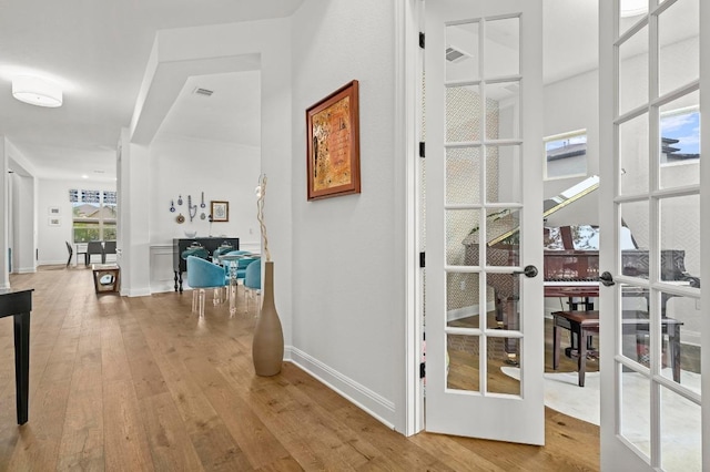 2625 Arion Cir, Austin, TX 78730 - hall featuring wood-type flooring, french doors, and baseboards