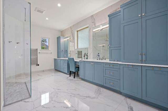 2625 Arion Cir, Austin, TX 78730 - bathroom with a marble finish shower, double vanity, marble tiled floors, recessed lighting, and baseboards