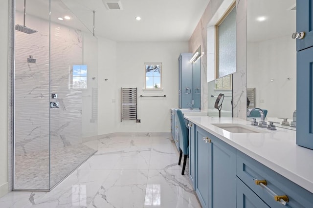 2625 Arion Cir, Austin, TX 78730 - bathroom with a marble finish shower, recessed lighting, double vanity, marble tiled flooring, and baseboards