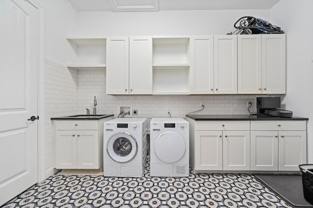 2625 Arion Cir, Austin, TX 78730 - washroom featuring separate washer and dryer and cabinet space