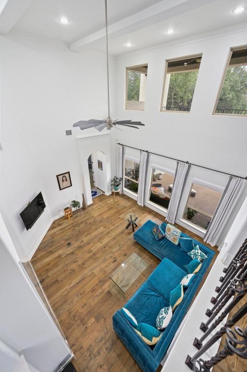 2625 Arion Cir, Austin, TX 78730 - interior space featuring wood finished floors, arched walkways, recessed lighting, crown molding, and ceiling fan