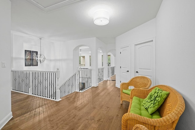 2625 Arion Cir, Austin, TX 78730 - corridor with an upstairs landing, arched walkways, wood finished floors, baseboards, and ornamental molding