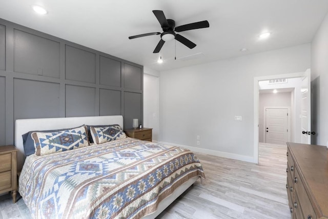 116 Mallard Rd, Bastrop, TX 78602 - bedroom featuring light wood-style flooring, recessed lighting, baseboards, a ceiling fan, and a decorative wall