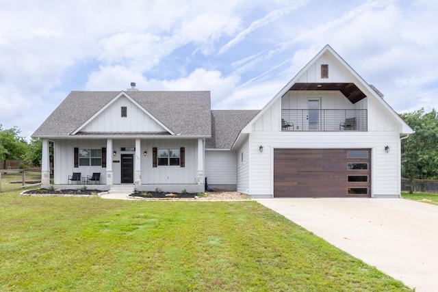 116 Mallard Rd, Bastrop, TX 78602 - modern farmhouse style home featuring board and batten siding, a shingled roof, covered porch, concrete driveway, and a garage