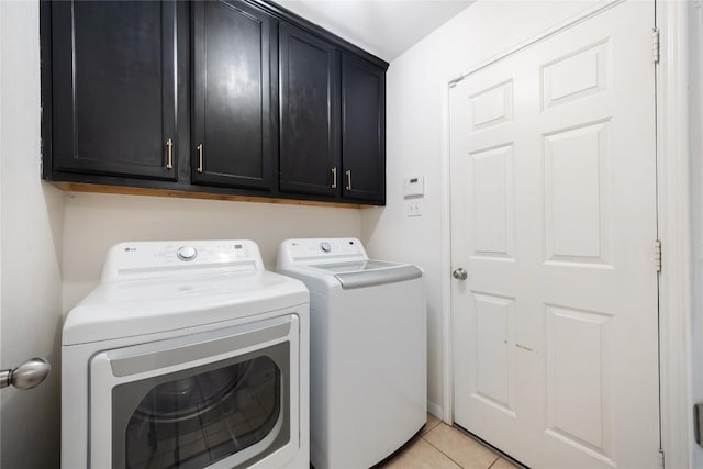 2627 Butterfly Dr, Temple, TX 76502 - washroom featuring washer and dryer, cabinet space, and light tile patterned floors