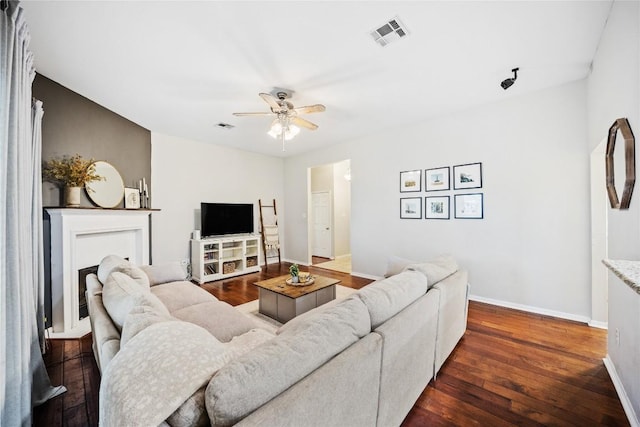 2627 Butterfly Dr, Temple, TX 76502 - living room with dark wood-type flooring, ceiling fan, and baseboards