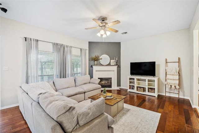 2627 Butterfly Dr, Temple, TX 76502 - living room with ceiling fan, wood-type flooring, baseboards, and a fireplace with flush hearth