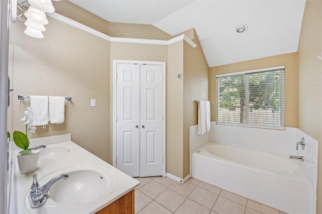 2627 Butterfly Dr, Temple, TX 76502 - bathroom with vaulted ceiling, a garden tub, tile patterned floors, and double vanity