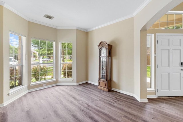 17704 Miller Falls Cv, Round Rock, TX 78681 - entryway with wood finished floors, arched walkways, and ornamental molding