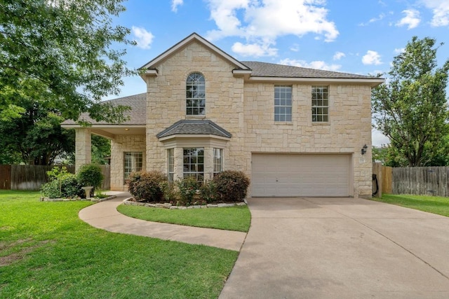 17704 Miller Falls Cv, Round Rock, TX 78681 - traditional-style house with stone siding, an attached garage, driveway, and roof with shingles