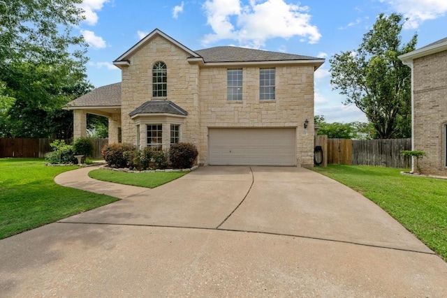 17704 Miller Falls Cv, Round Rock, TX 78681 - traditional home with stone siding, an attached garage, driveway, and roof with shingles