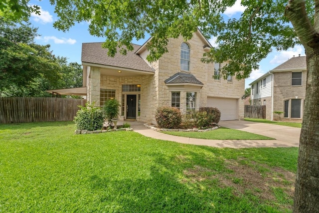 17704 Miller Falls Cv, Round Rock, TX 78681 - traditional-style home with stone siding, an attached garage, concrete driveway, and roof with shingles