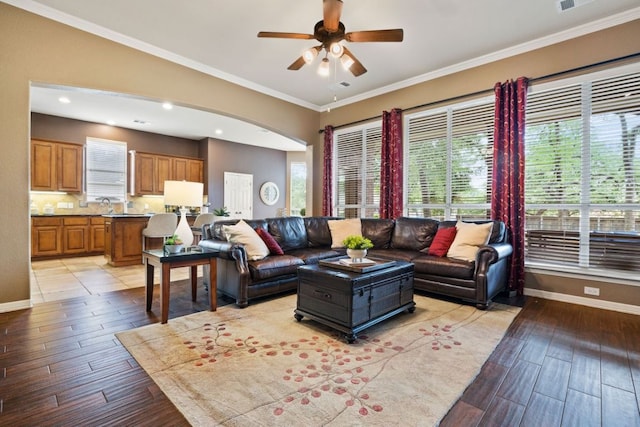 1613 Westend Pl, Round Rock, TX 78681 - living area featuring light wood finished floors, a ceiling fan, ornamental molding, and recessed lighting