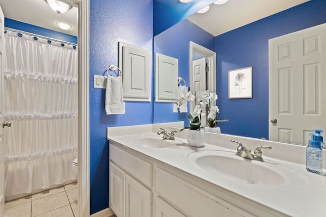 1613 Westend Pl, Round Rock, TX 78681 - full bathroom with double vanity, tile patterned flooring, curtained shower, and a textured wall