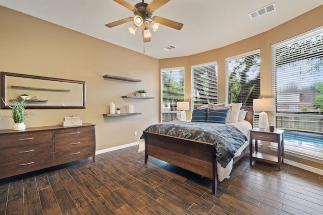 1613 Westend Pl, Round Rock, TX 78681 - bedroom featuring dark wood-style floors, multiple windows, and ceiling fan