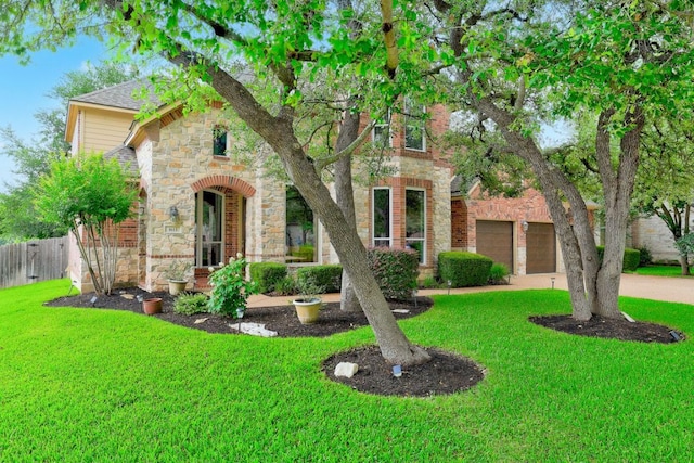1613 Westend Pl, Round Rock, TX 78681 - view of front facade featuring stone siding, a garage, and brick siding