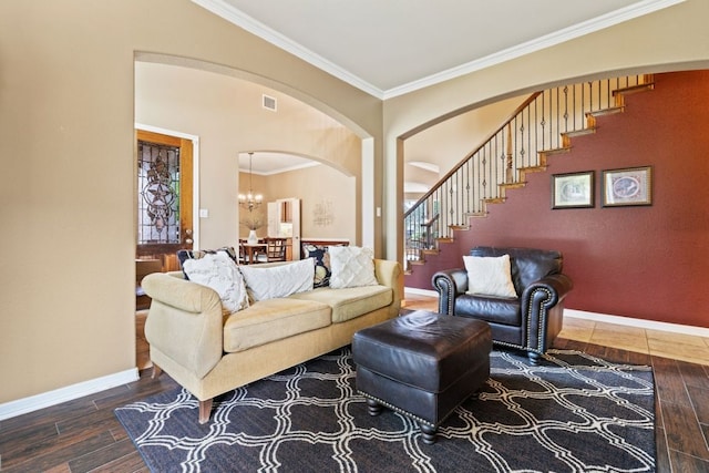 1613 Westend Pl, Round Rock, TX 78681 - living room featuring wood finished floors, ornamental molding, stairway, a chandelier, and arched walkways