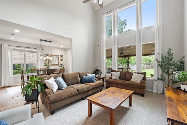 2705 Rosemount Cv, Round Rock, TX 78665 - living area featuring a towering ceiling, a ceiling fan, and recessed lighting