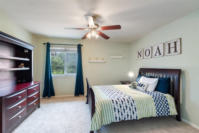 2705 Rosemount Cv, Round Rock, TX 78665 - bedroom featuring light colored carpet, baseboards, and a ceiling fan