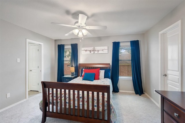 2705 Rosemount Cv, Round Rock, TX 78665 - carpeted bedroom with baseboards, multiple windows, and a ceiling fan