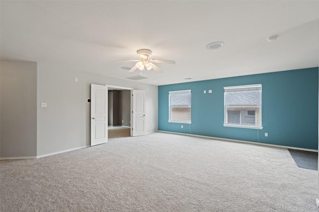 2705 Rosemount Cv, Round Rock, TX 78665 - carpeted empty room with a ceiling fan and baseboards